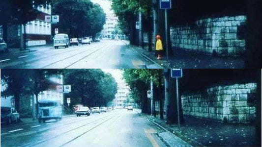 Child waiting at a pedestrian crossing