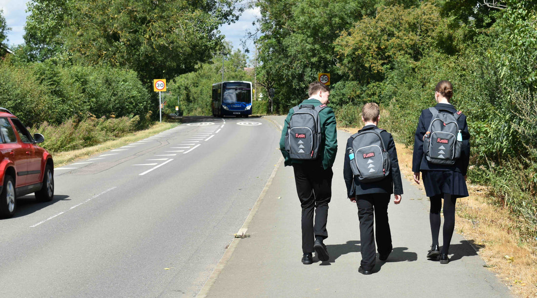 Three teenagers carrying Futliit LED backpacks
