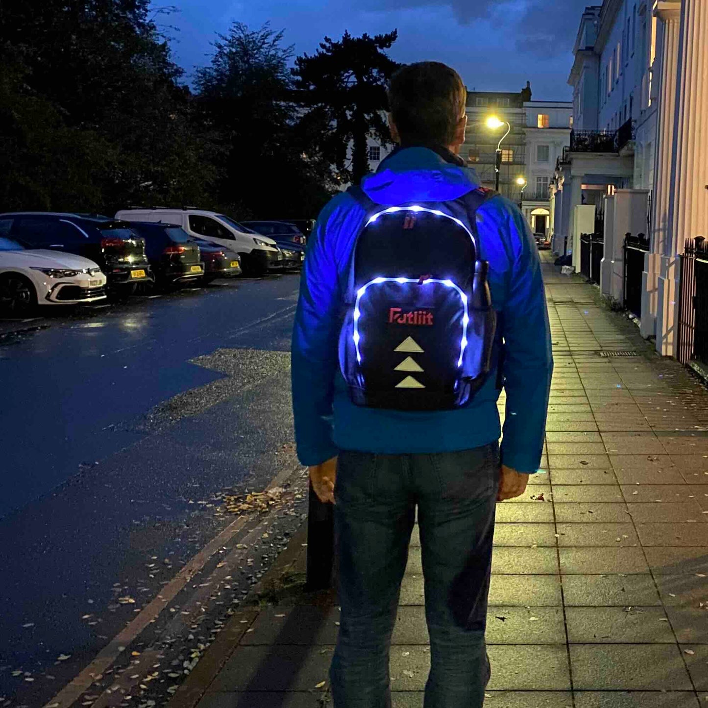 Man wearing Futliit LED backpack in the dark