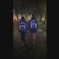 2 teens walking with Futliit LED backpacks at night